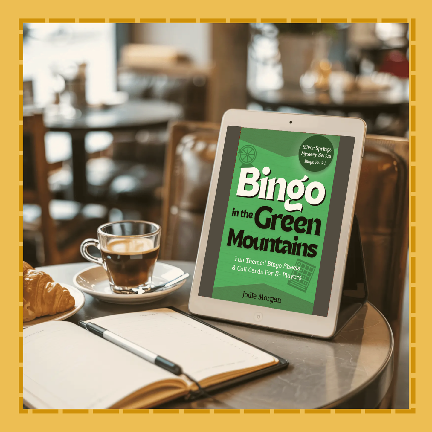 Tablet displaying 'Bingo in the Green Mountains' on a table with a cup of coffee and notebook.