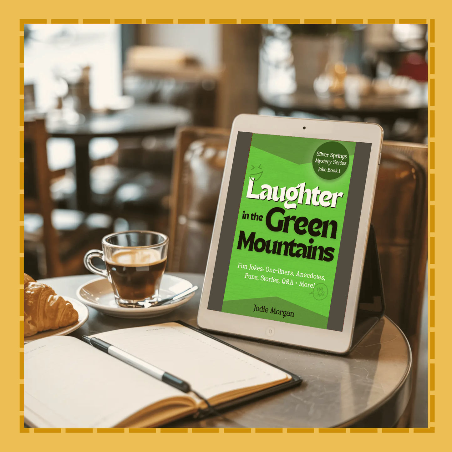 Tablet displaying 'Laughter in the Green Mountains' on a table with a cup of coffee and notebook.
