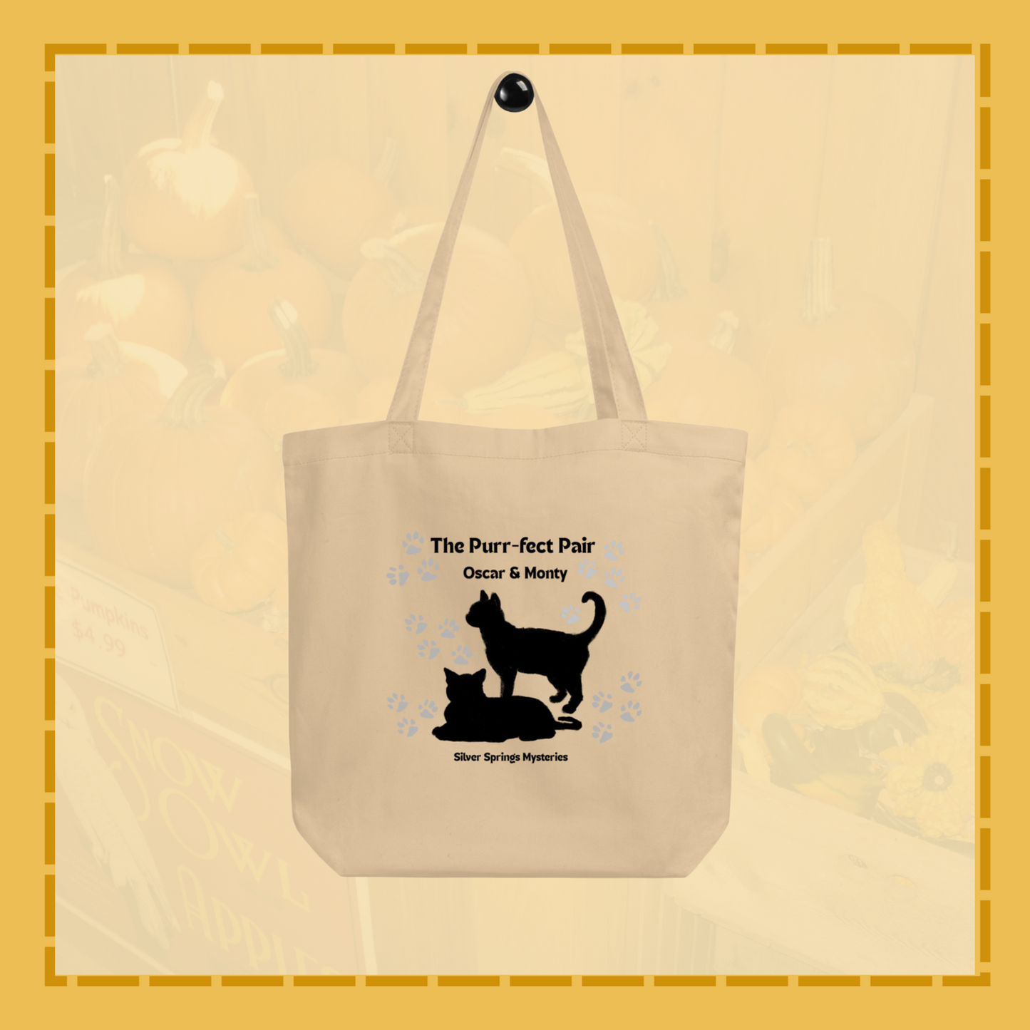 Beige tote bag with black cat design and text on a beige background