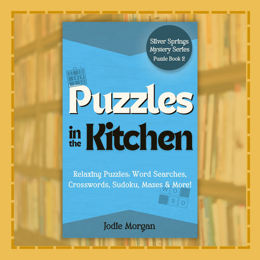Book titled 'Puzzles in the Kitchen' by Jodie Morgan on a blue background with a yellow border.