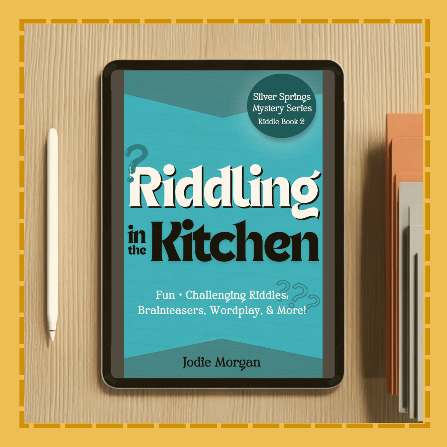 Tablet displaying the book cover of 'Riddling in the Kitchen' by Jodle Morgan on a wooden surface.