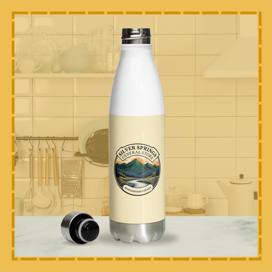 Bottle with a label on a kitchen counter, featuring a scenic design.