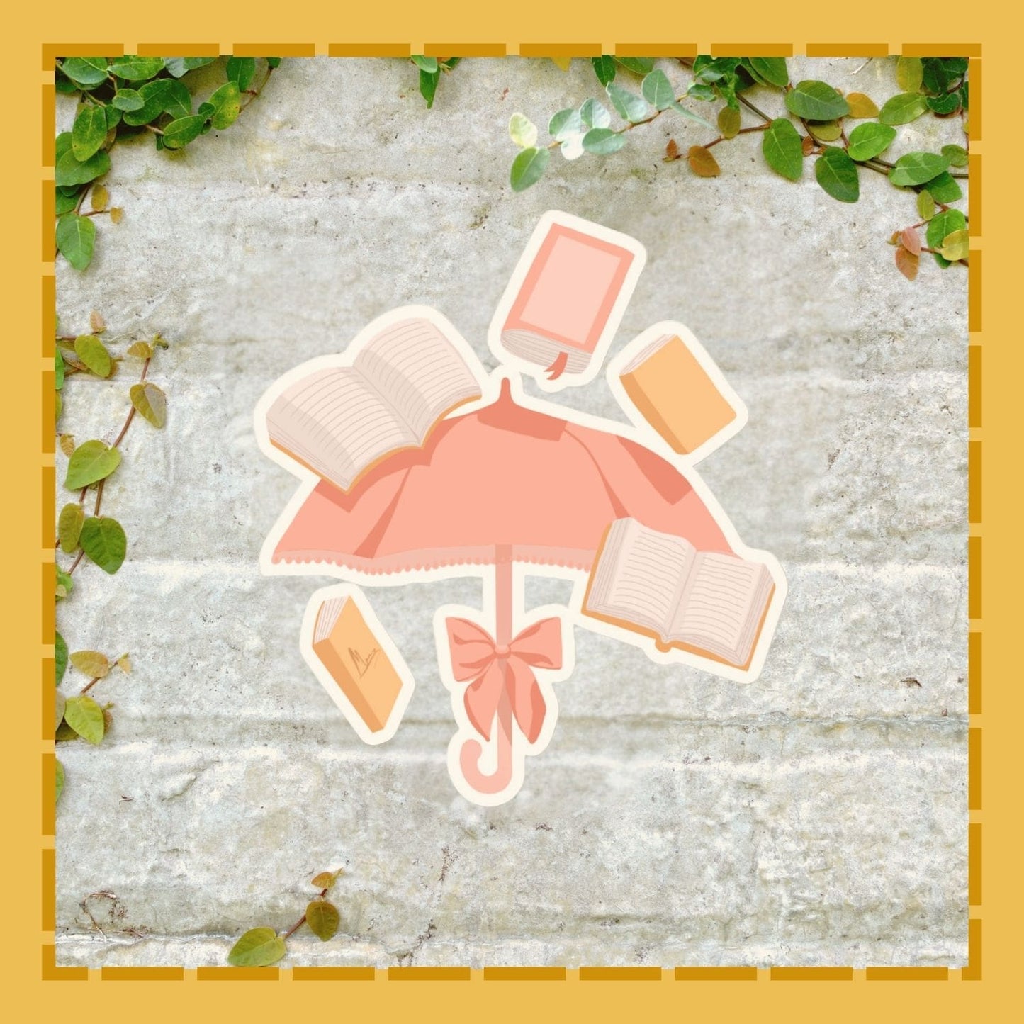 Pink umbrella with books on a stone surface surrounded by green leaves.