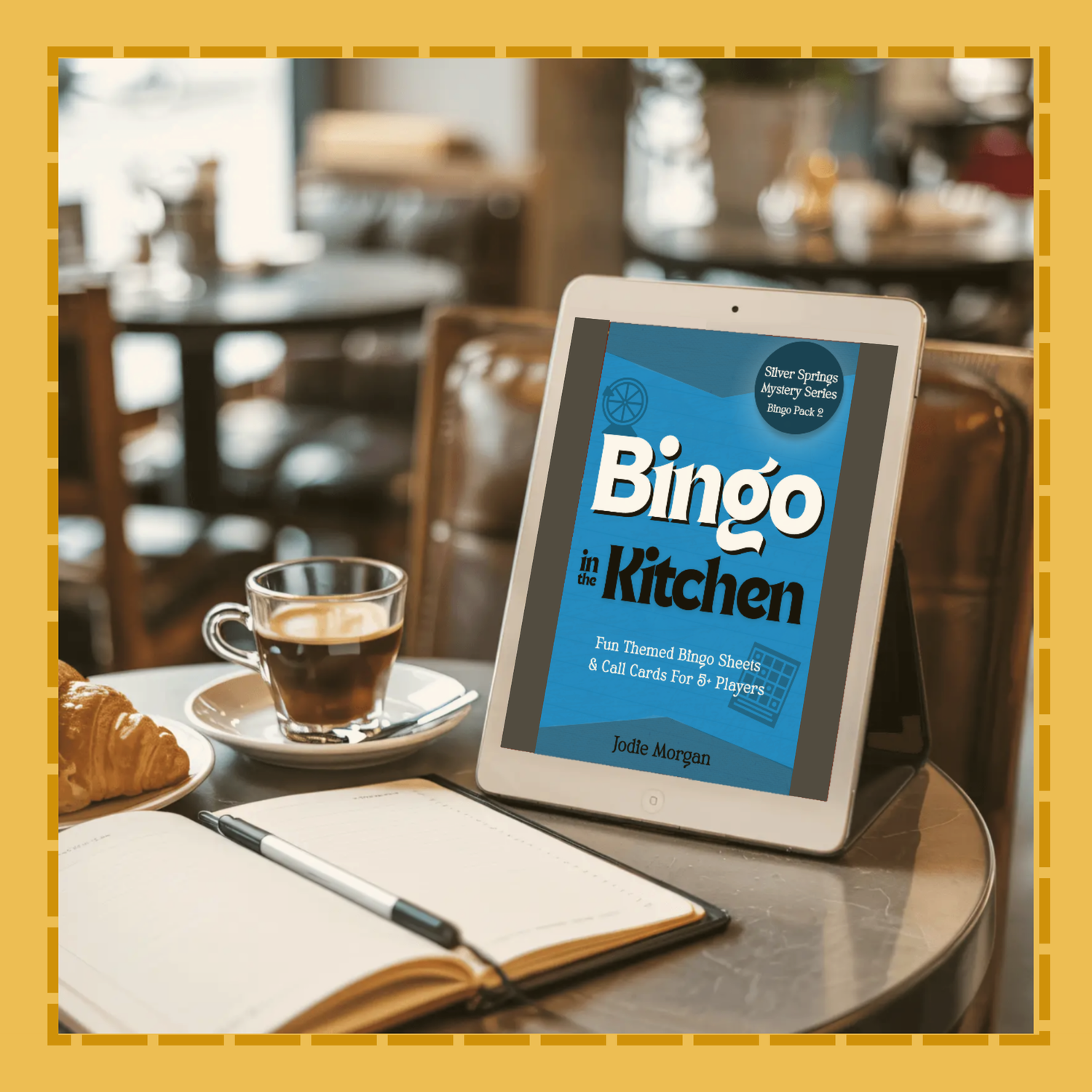 Tablet displaying 'Bingo in the Kitchen' on a table with a cup of coffee and a pastry.