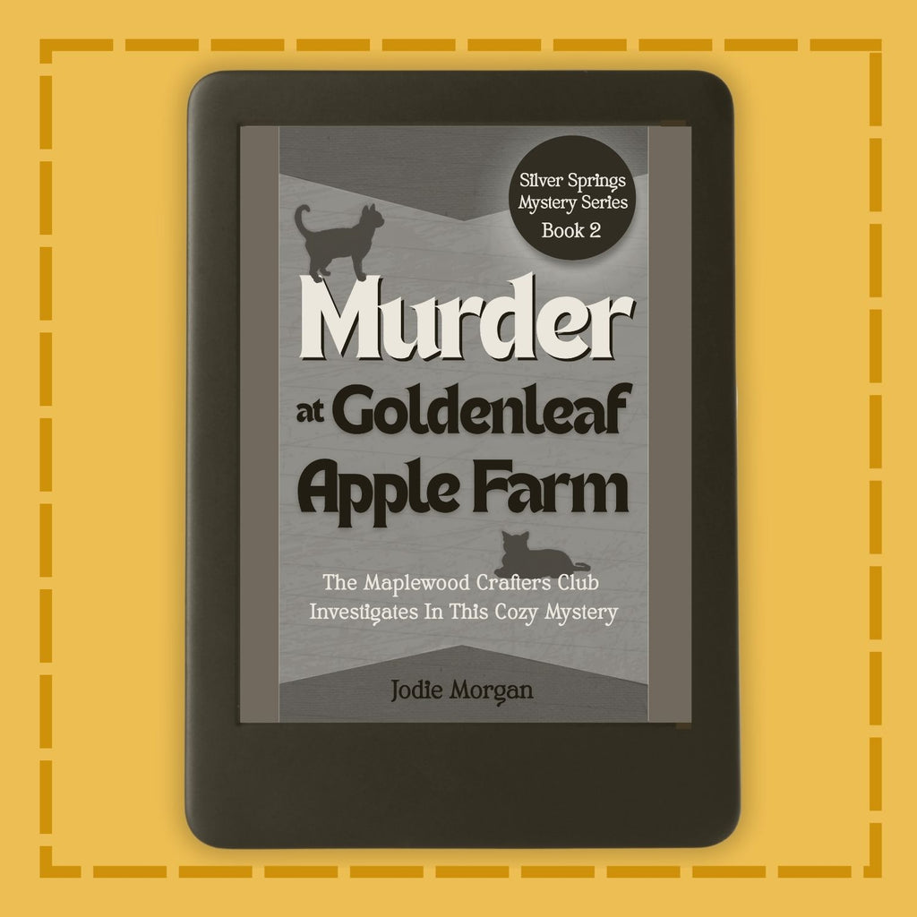 E-reader displaying the book cover of 'Murder at Goldenleaf Apple Farm' on a yellow background