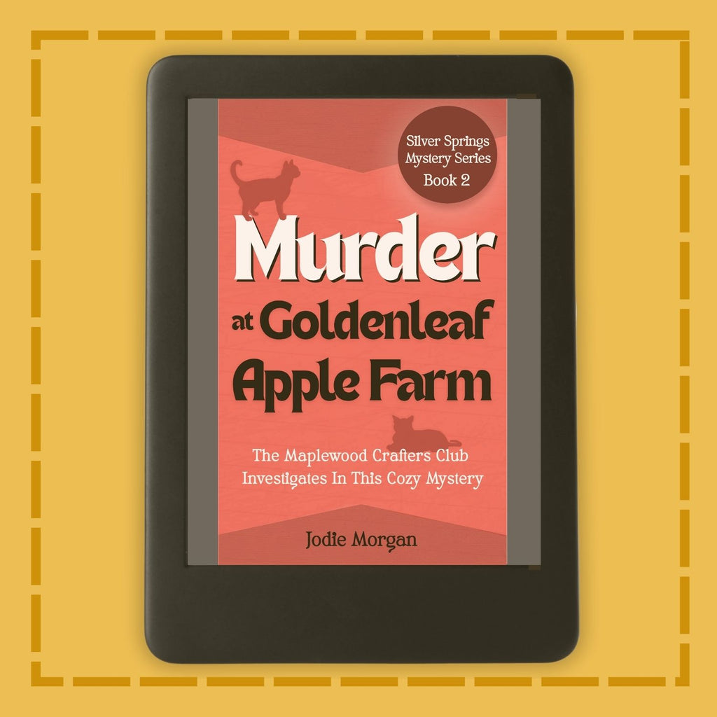E-reader displaying the book cover of 'Murder at Goldenleaf Apple Farm' on a yellow background