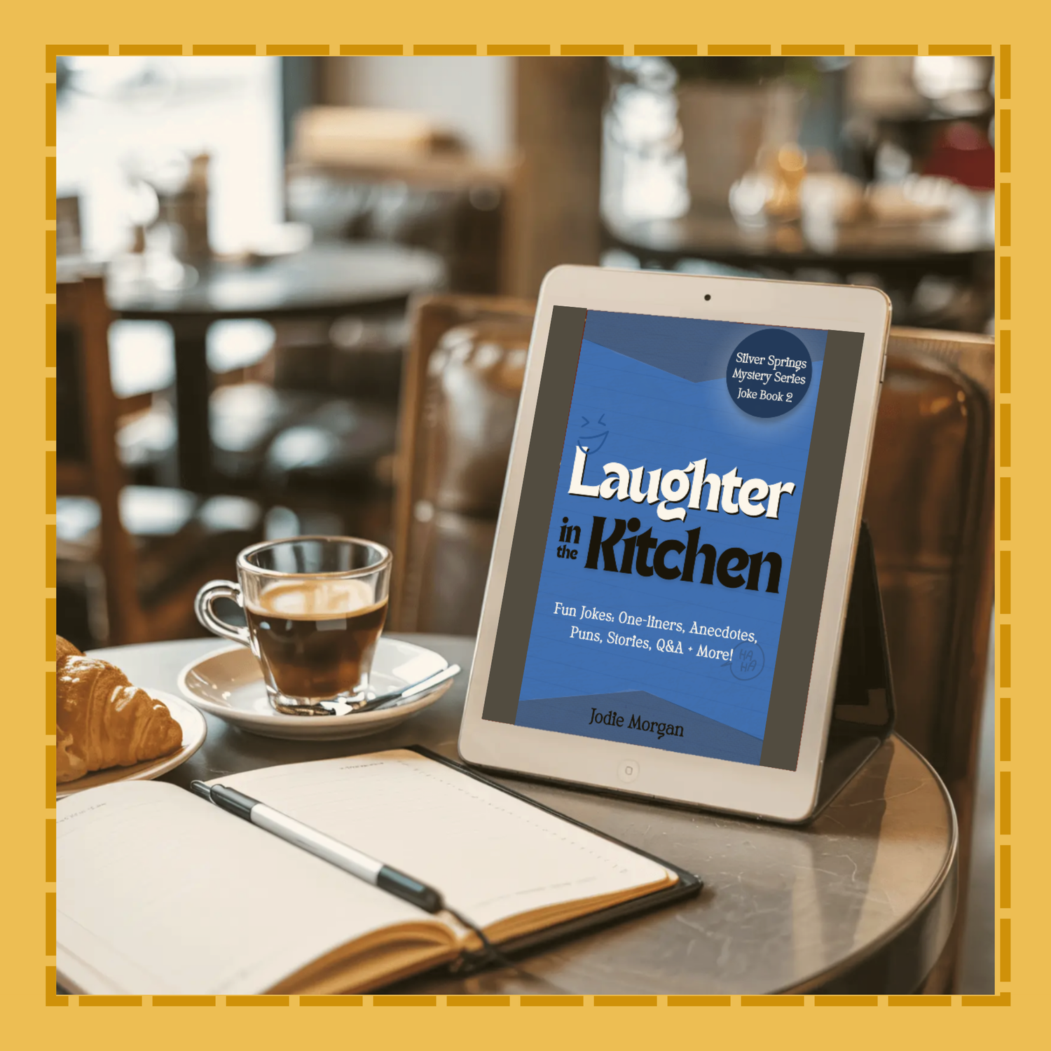 Tablet displaying 'Laughter in Kitchen' on a table with a cup of coffee and notebook.