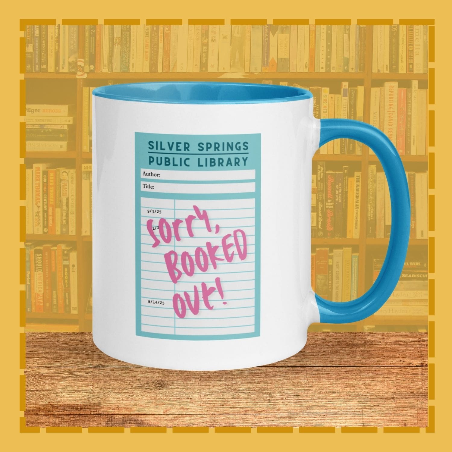 Mug with 'Sorry, Booked Out!' text on a library-themed design against a bookshelf background