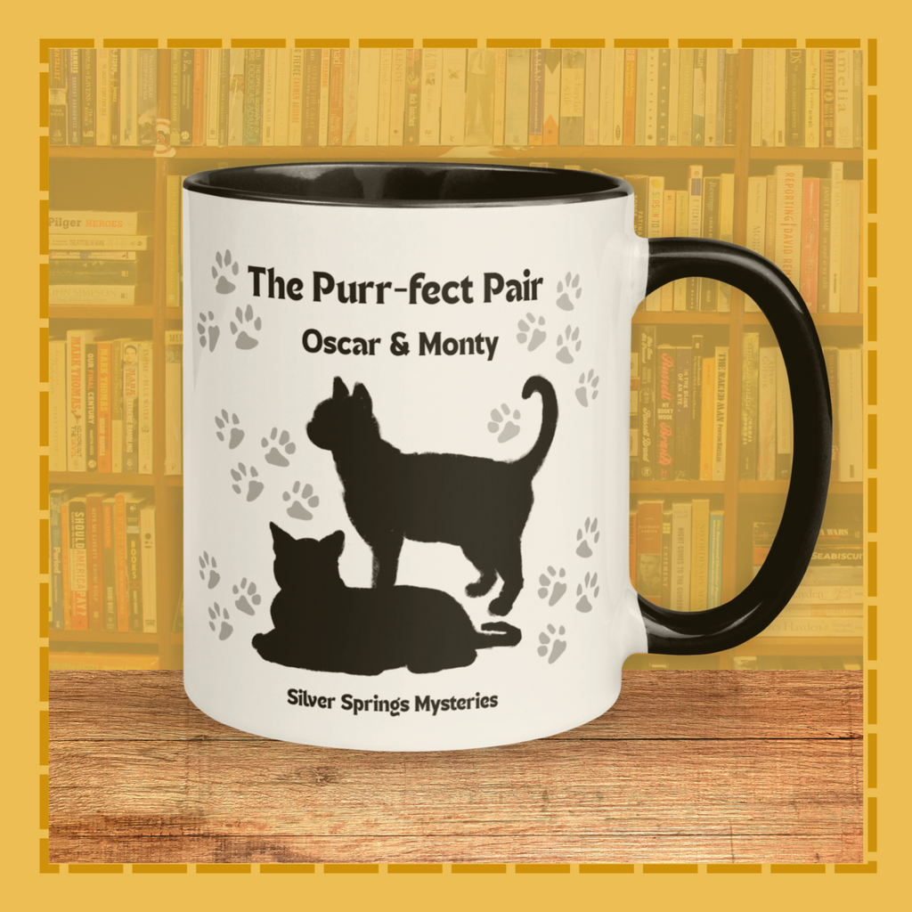 Mug with cat silhouettes and text on a bookshelf background