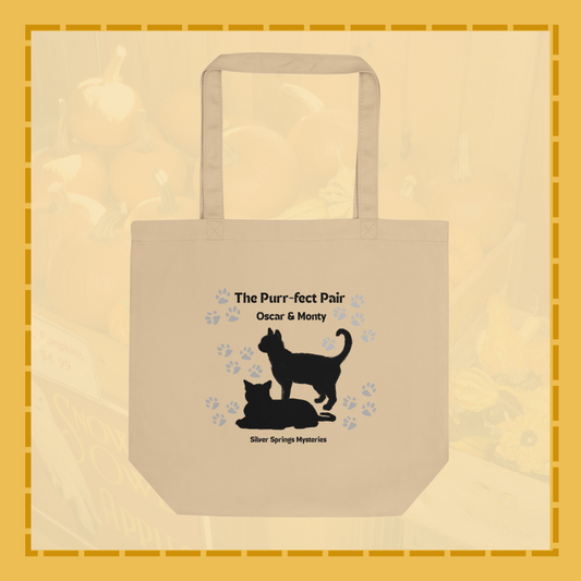 Beige tote bag with black cat design and text on a beige background