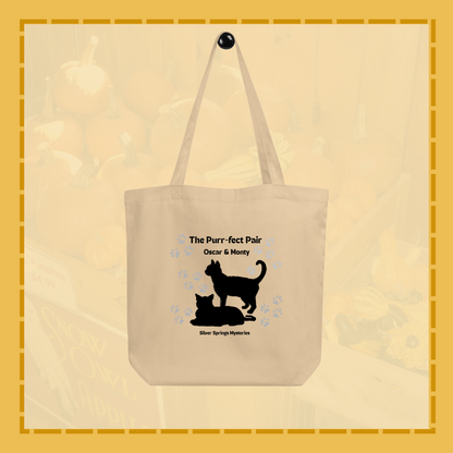 Beige tote bag with black cat design and text on a beige background