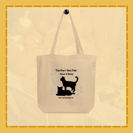 Beige tote bag with black cat design and text on a beige background