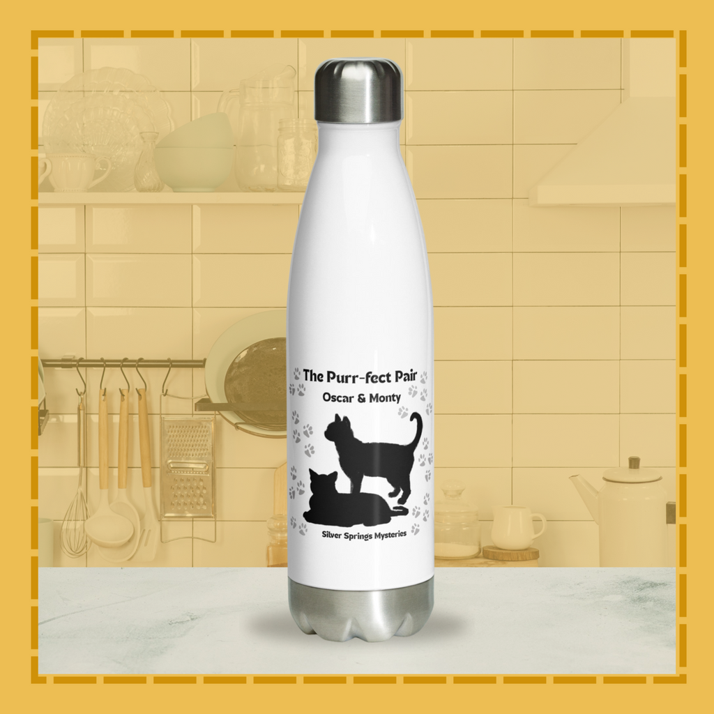 White water bottle with black cat illustrations and text on a kitchen counter.