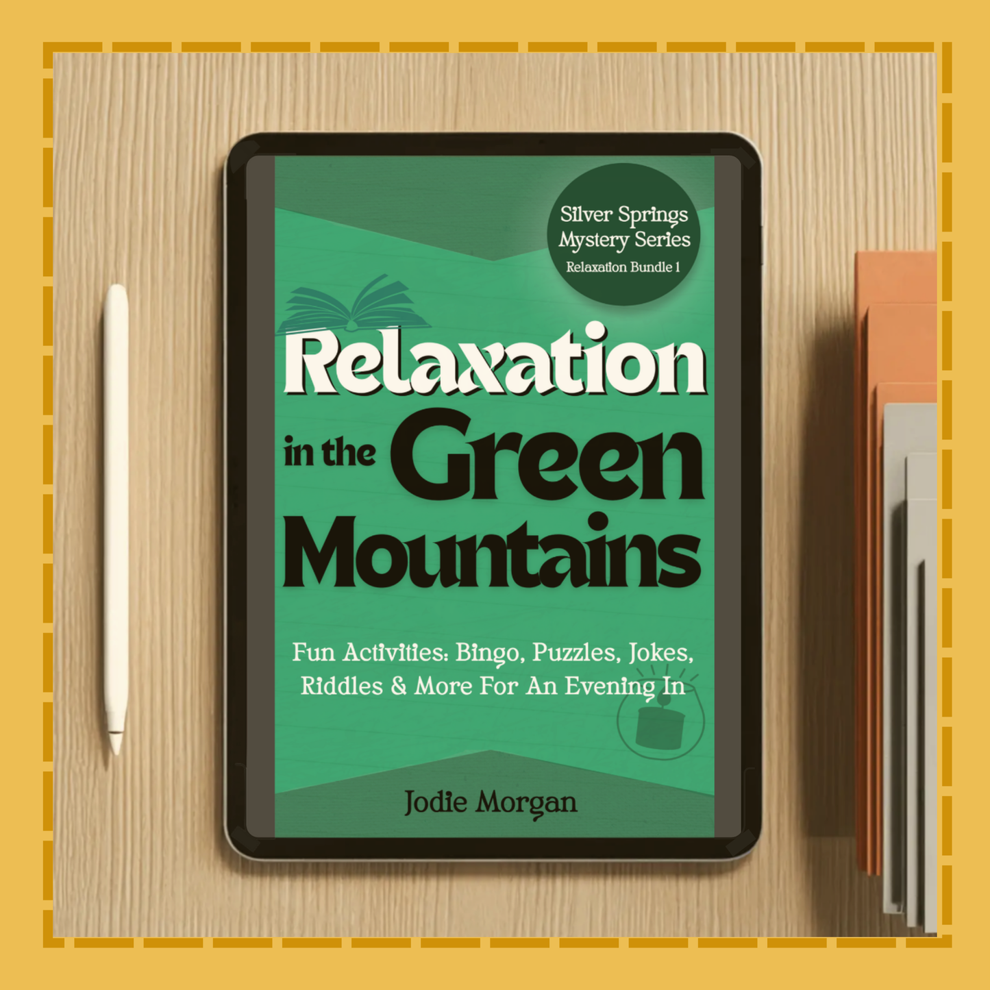Digital book cover of 'Relaxation in the Green Mountains' on a tablet with a pen and notebook on a wooden surface.