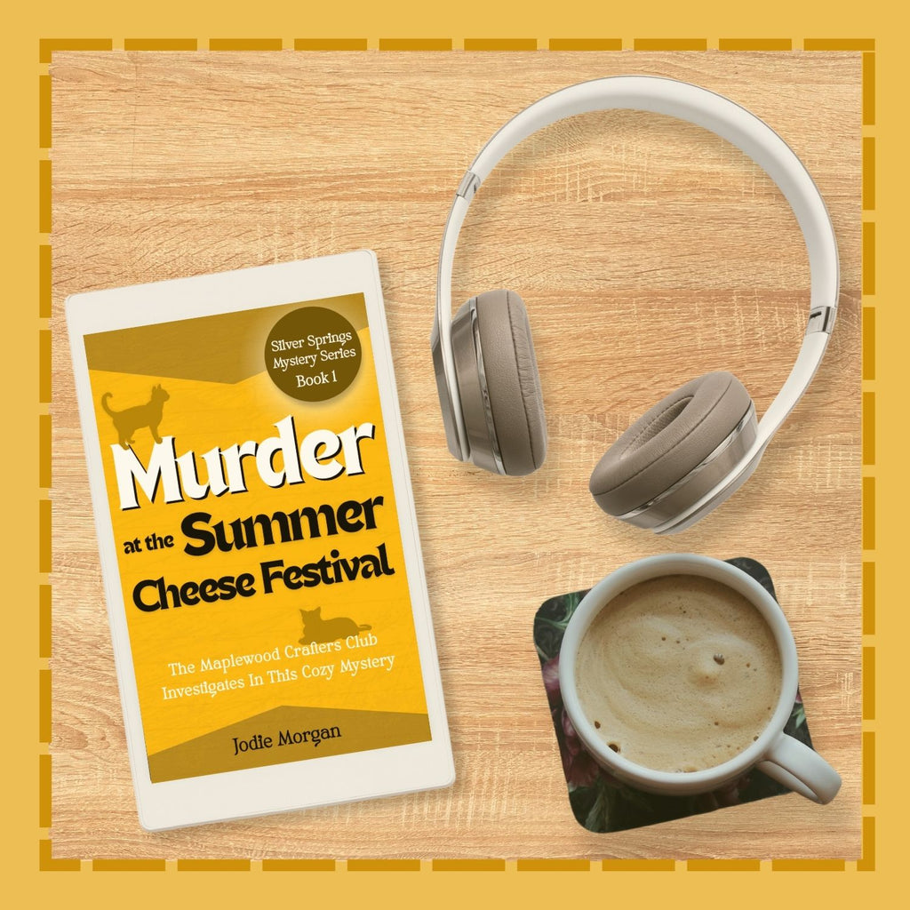 Book titled 'Murder at the Summer Cheese Festival' with a cup of coffee and headphones on a wooden surface.