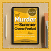 Murder At The Summer Cheese Festival on a tablet on a wooden table.