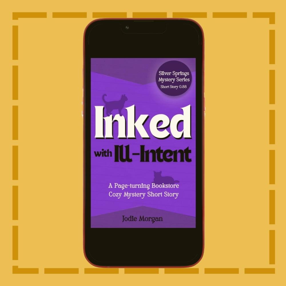 Phone displaying the book cover of 'Inked with Ill-Intent' on a yellow background
