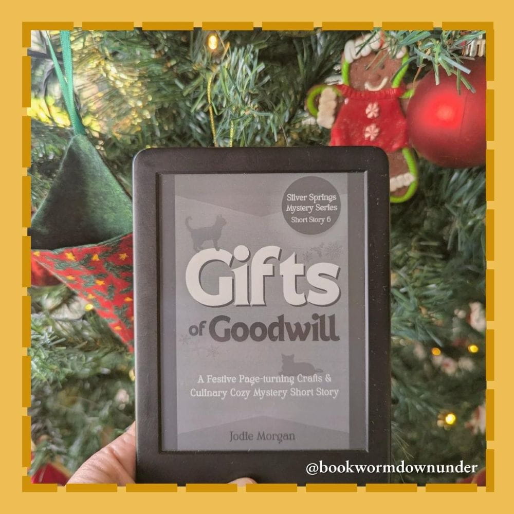 E-reader displaying a book cover with a Christmas tree in the background