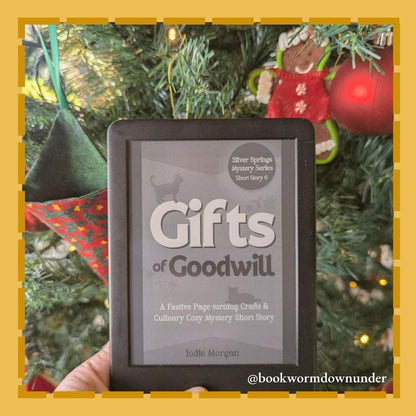 E-reader displaying a book cover with a Christmas tree in the background