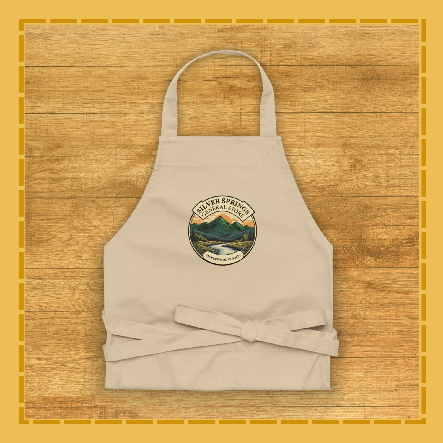 Beige apron with a logo on a wooden surface