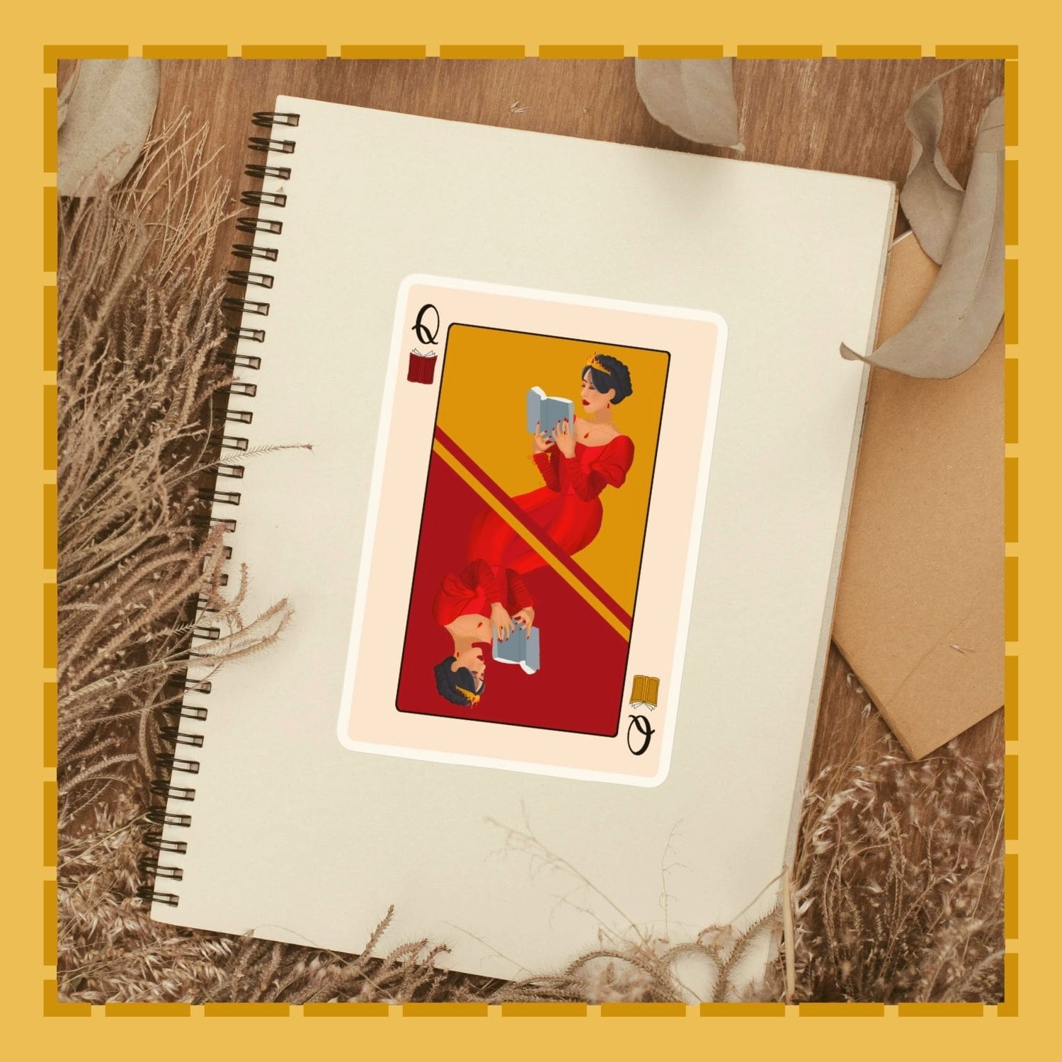 Playing card with a woman in a red dress on a notebook