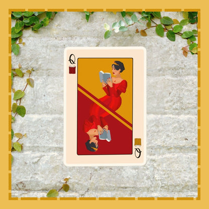 Playing card with a Queen of Hearts design on a textured stone background with greenery.