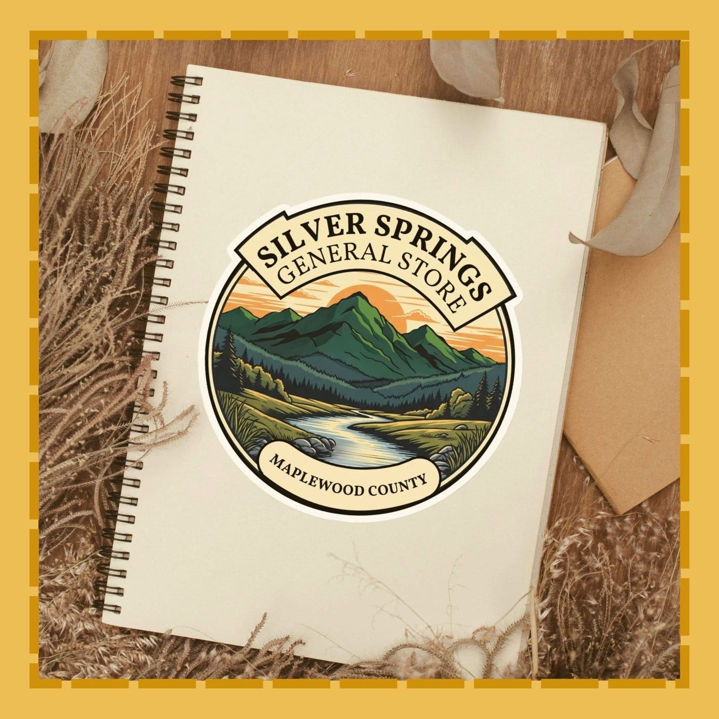 Notebook with Silver Springs General Store logo on a wooden surface