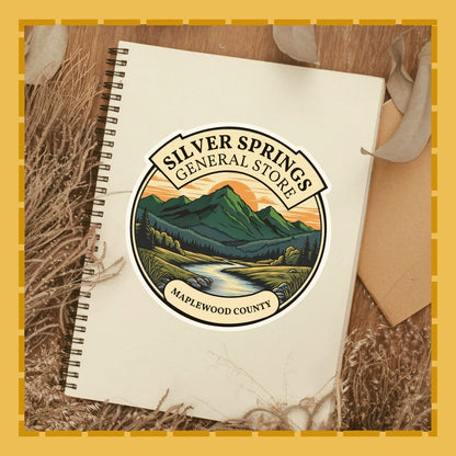 Notebook with Silver Springs General Store logo on a wooden surface