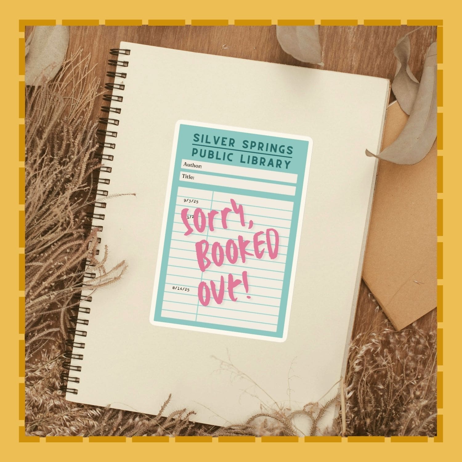 Notebook with a library reservation slip on top, set against a natural background.